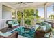 Cozy outdoor living space with wicker furniture, ceiling fan, and views, creating a serene retreat at 1621 Folly Creek Way # D-8, Charleston, SC 29412