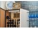 A close-up of the custom wine storage in a well-appointed entertaining area at 1621 Folly Creek Way # D-8, Charleston, SC 29412