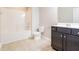 Well-lit bathroom with tub-shower combination and dark cabinets at 167 Meadow Wood Rd, Summerville, SC 29486