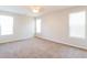 Bright, carpeted bedroom with natural light from three windows and ceiling fan at 167 Meadow Wood Rd, Summerville, SC 29486