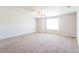 Spacious, carpeted bedroom with a ceiling fan and large window offering natural light at 167 Meadow Wood Rd, Summerville, SC 29486