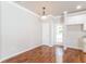 Dining space with wood floors adjacent to kitchen, perfect for intimate dinners at 167 Meadow Wood Rd, Summerville, SC 29486
