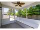 Screened-in porch with a ceiling fan and built-in bench seating at 167 Meadow Wood Rd, Summerville, SC 29486