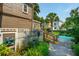 Inviting backyard with a pool, wooden walkway, and beautifully landscaped surroundings at 171 Queen St, Charleston, SC 29401