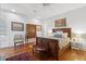 Classic bedroom with hardwood floors, a carved wooden bed frame, and multiple decorative wall paintings at 171 Queen St, Charleston, SC 29401