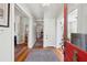 Bright foyer with hardwood floors, a decorative rug, and views into multiple rooms at 171 Queen St, Charleston, SC 29401