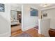 Hallway view to bedroom with bed and desk at 171 Queen St, Charleston, SC 29401