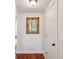 Hallway with decorative mirror and view to adjacent room at 171 Queen St, Charleston, SC 29401