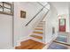 Staircase leading to the second floor with wood flooring at 171 Queen St, Charleston, SC 29401