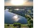 Scenic aerial view of lakeside community featuring colorful homes and waterfront views at 1894 Brittlebush Ln, Johns Island, SC 29455