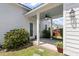 Inviting backyard featuring a covered patio with a ceiling fan, lush greenery, and outdoor seating for relaxing at 1894 Brittlebush Ln, Johns Island, SC 29455