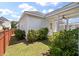 A view of home featuring lush greenery, a cozy covered patio and manicured landscaping in a backyard setting at 1894 Brittlebush Ln, Johns Island, SC 29455