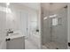 Bathroom featuring a glass shower, soaking tub, double sinks and marble countertops at 1894 Brittlebush Ln, Johns Island, SC 29455