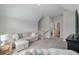 Cozy bonus room featuring a comfortable sofa and access to a full bathroom at 1894 Brittlebush Ln, Johns Island, SC 29455