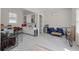 Finished garage with a built-in bar area with white cabinets and stainless steel mini fridge at 1894 Brittlebush Ln, Johns Island, SC 29455