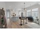 Open-concept kitchen area featuring a center island, bar seating, and modern appliances at 1894 Brittlebush Ln, Johns Island, SC 29455