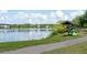 Lakeside recreational area featuring kayak storage on a stand and a walking path at 1894 Brittlebush Ln, Johns Island, SC 29455