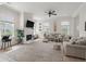 Bright living room featuring a cozy fireplace, comfortable seating, and stylish decor elements at 1894 Brittlebush Ln, Johns Island, SC 29455