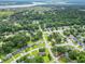 From above, discover a serene neighborhood nestled among lush trees, winding roads, and coastal views at 2020 Piper Dr, Charleston, SC 29407