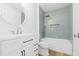 A modern bathroom features tile accent wall, shower and white vanity at 2020 Piper Dr, Charleston, SC 29407