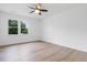 Bright bedroom with laminate flooring, white walls and ceiling fan at 2020 Piper Dr, Charleston, SC 29407