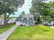 Charming two-story home with a well-manicured lawn, a cozy front porch, and an attached garage at 2020 Piper Dr, Charleston, SC 29407