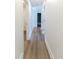 Hallway with laminate flooring leading to other rooms at 2020 Piper Dr, Charleston, SC 29407