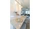 Kitchen island with a view into the Gathering room, and modern lighting fixture at 2020 Piper Dr, Charleston, SC 29407