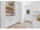 Bright, white kitchen with modern cabinets, granite countertops, and open shelving at 2020 Piper Dr, Charleston, SC 29407