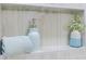 Shower featuring built in shelving, decorative flowers, soap and a neatly folded white towel at 2020 Piper Dr, Charleston, SC 29407