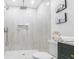 Shower featuring grey tile, overhead shower head, built-in shelves and white shower pan at 2020 Piper Dr, Charleston, SC 29407