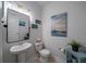 Stylish half bath with a pedestal sink and modern decor at 2024 Lanneau Ln, Johns Island, SC 29455