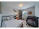 Charming bedroom featuring a crib, gray furniture and a cozy atmosphere at 2024 Lanneau Ln, Johns Island, SC 29455