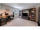 Spacious bonus room with built-in shelving, desk area, and plenty of natural light at 2024 Lanneau Ln, Johns Island, SC 29455