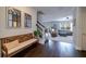 Welcoming entryway with dark hardwood floors, a wooden bench and mirrors at 2024 Lanneau Ln, Johns Island, SC 29455