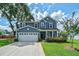 Charming two-story home featuring a well-manicured lawn and a two car garage at 2024 Lanneau Ln, Johns Island, SC 29455