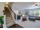 Inviting living space with stairs, a cozy living room, dining room, and bright windows at 2024 Lanneau Ln, Johns Island, SC 29455