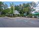 Community pool area with covered seating and accessible parking on a sunny day at 2024 Lanneau Ln, Johns Island, SC 29455