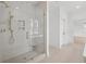 Bathroom featuring a glass shower, tiled walls, and a built in bench at 2027 Riverbend Dr, James Island, SC 29412