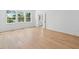 Light filled bedroom with hardwood floors and access to an ensuite bathroom at 2027 Riverbend Dr, James Island, SC 29412
