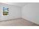 A bright bedroom with ample light from the large window and plush carpet at 2027 Riverbend Dr, James Island, SC 29412