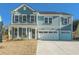 Charming two-story home featuring a covered porch and a spacious three-car garage at 2027 Riverbend Dr, James Island, SC 29412