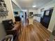 Bright kitchen with light wood floors, white cabinets, a center island, and modern appliances at 205 Indian Field Cir, Saint George, SC 29477