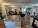 Open concept living space combining the kitchen, dining, and living areas featuring wood floors at 205 Indian Field Cir, Saint George, SC 29477