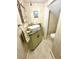 Small half-bathroom with stylish wallpaper, granite countertop, and updated sink at 2066 Wappoo Dr, Charleston, SC 29412