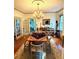 Dining room with hardwood floors, elegant chandelier, and access to an adjoining room at 2066 Wappoo Dr, Charleston, SC 29412
