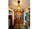 Charming hallway featuring wooden accents and a glass display cabinet for collectables at 2066 Wappoo Dr, Charleston, SC 29412