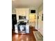 Bright kitchen featuring a stainless steel stove and a cozy breakfast nook at 2066 Wappoo Dr, Charleston, SC 29412