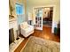 Cozy living room with a fireplace and dining room beyond at 2066 Wappoo Dr, Charleston, SC 29412