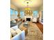 Cozy living room boasts a decorative fireplace, hardwood floors, and natural light at 2066 Wappoo Dr, Charleston, SC 29412